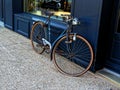 Vintage bicycle leaning against a shop window