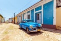 Vintage blue car near Houses in the old town, Trinidad Royalty Free Stock Photo