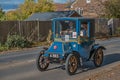 A vintage Blue car taking part in the London-Brighton Rally going through Burgess Hill, Sussex,England