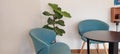 Vintage blue chair and black table, minimalist style, relaxing corner for drinking in a coffee shop Royalty Free Stock Photo