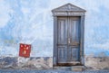 Vintage Blue Door With a Touch of Red Royalty Free Stock Photo