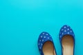 Vintage blue pair of polka dot shoes on a blue background Royalty Free Stock Photo