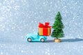 Vintage blue pickup truck by a Christmas tree Royalty Free Stock Photo