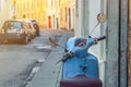 Vintage blue scooter motorbike Vespa in narrow italian empty street