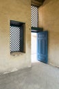 Vintage blue wooden window and door with yellowplaster wall Royalty Free Stock Photo