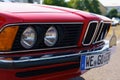 A vintage BMW 635. Front view of the bumper, hood, grille and headlights.