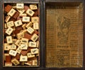 Vintage Bone and bamboo Mahjong or mah-jongg playing tiles in box. Background.