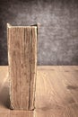 Vintage book on brown table made of wooden planks Royalty Free Stock Photo