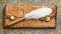 A vintage book with a leather binding, a quill, and a background composed of various documents Royalty Free Stock Photo
