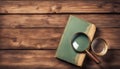 Vintage book and magnifying glass on wooden background