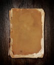 Vintage book on wood with clipping path. Royalty Free Stock Photo