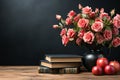 Vintage books and a bouquet of pink roses on background of a black school board Royalty Free Stock Photo