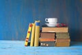 Vintage books with coffee cup and specs Royalty Free Stock Photo