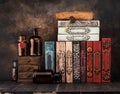 Vintage books, pharmacy bottles, manuscript with a wax seal on the shelf. Royalty Free Stock Photo