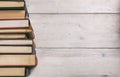 Vintage books stack on wooden background - copy space Royalty Free Stock Photo