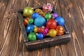 Vintage wooden box with colored bright Christmas tree balls Royalty Free Stock Photo