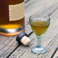 Vintage brandy glass with bottle and cork