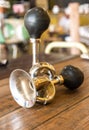 Vintage brass bicycle horn on wooden Table Royalty Free Stock Photo