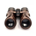 Vintage brass binoculars with leather accents and a textured grip Royalty Free Stock Photo