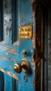 Vintage brass door knob on a distressed blue wooden door with a Do not disturb sign, conveying a request for privacy and Royalty Free Stock Photo