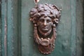 Vintage brass door knocker on an old door, Italy, Rome Royalty Free Stock Photo