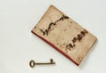 Vintage brass key and old book. Royalty Free Stock Photo