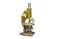 Vintage brass microscope on white surface in a pharmacy antique cabinet a Royalty Free Stock Photo