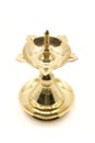 a vintage, brass oil lamp of unique traditional design