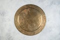 Vintage brass plate with embossed floral pattern Royalty Free Stock Photo
