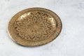 Vintage brass plate with embossed floral pattern Royalty Free Stock Photo