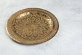 Vintage brass plate with embossed floral pattern Royalty Free Stock Photo