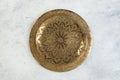 Vintage brass plate with embossed floral pattern Royalty Free Stock Photo