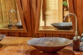 Vintage brass wash basin in wooden bathroom. Royalty Free Stock Photo