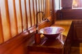 Vintage brass wash basin in wooden bathroom. Royalty Free Stock Photo