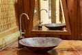 Vintage brass wash basin in wooden bathroom. Royalty Free Stock Photo