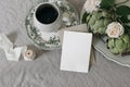 Vintage breakfast still life. Cup of coffee, rose flowers and artichoke vegetable. Porcelain plate. Blank greeting card