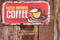 Vintage Brew: Fresh Coffee Delights with a Nostalgic Sign