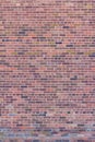 Vintage brick wall background with colorful bricks in shades of rose, and green Royalty Free Stock Photo