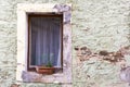 vintage brick wall background with old windowold window with flowers on a stone wall Royalty Free Stock Photo