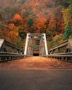 Vintage bridge atop a mountainous terrain, stretching across the horizon in a magnificent sight