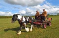 Vintage Brightly painted Heavy Horse drawn delivery wagon on the move. Royalty Free Stock Photo