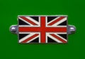 Vintage British Union Jack flag badge on a racing green coloured car close up Royalty Free Stock Photo