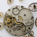 Vintage broken clockwork on the white background.