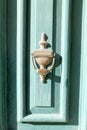 Vintage bronze door handle on old maltese green wooden door, Valletta, Malta