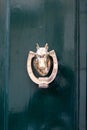 Vintage bronze door handle on old maltese green wooden door, Valletta, Malta