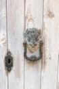 Vintage bronze lion head knocker on vintage wooden door, Gozo, Malta Royalty Free Stock Photo