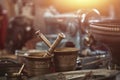 Vintage bronze mortars, copper cups and plates, sewing machine on countertop in sunday flea market. Royalty Free Stock Photo