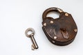 Vintage bronze padlock with the key isolated on white background Royalty Free Stock Photo