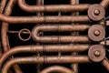 Vintage bronze pipes, valve, key mechanical elements french horn, black background. Good pattern, prompt music instrument. Royalty Free Stock Photo