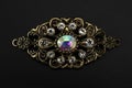 Vintage brooch with diamonds isolated on black